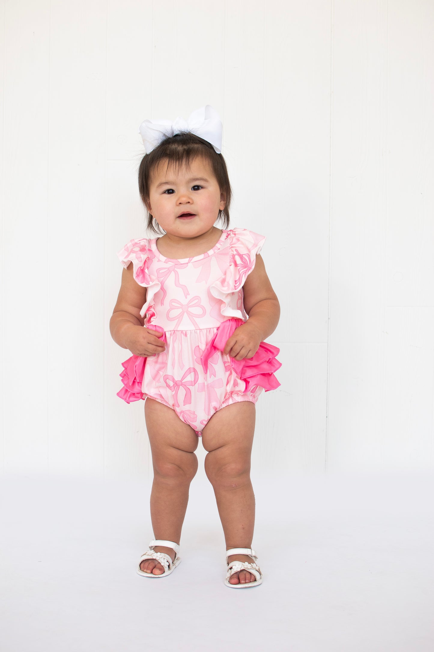Pretty in Pink Bow Ruffle Romper