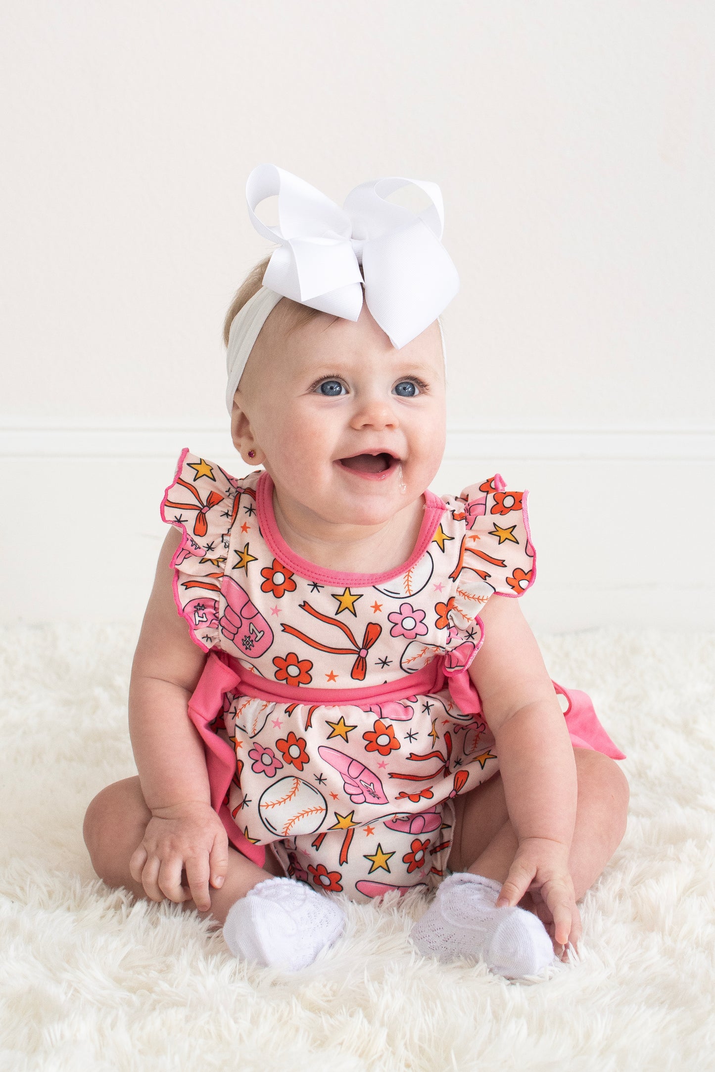 Pink baseball print ruffle bubble